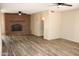 Living room featuring a brick fireplace, neutral walls, recessed lighting, ceiling fan, and tile flooring at 5529 W Zoe Ella Way, Glendale, AZ 85306