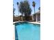 Sparkling pool and a lush landscape, creating a tranquil oasis for recreation at 5529 W Zoe Ella Way, Glendale, AZ 85306