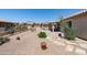 Well maintained desert landscaping with stone walkways, patio and mature desert plants at 6080 S Jojoba Ct, Gold Canyon, AZ 85118