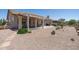 Spacious backyard with covered patio, desert landscaping and ample space for outdoor enjoyment at 6080 S Jojoba Ct, Gold Canyon, AZ 85118