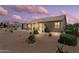 Desert landscaped backyard with covered patio and sliding glass doors for indoor/outdoor living at 6080 S Jojoba Ct, Gold Canyon, AZ 85118
