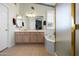 Bright bathroom featuring double sinks, a soaking tub, and a separate shower at 6080 S Jojoba Ct, Gold Canyon, AZ 85118