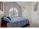 Serene bedroom with natural light, a comfortable bed, and access to closet at 6080 S Jojoba Ct, Gold Canyon, AZ 85118
