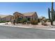 Charming home exterior featuring desert landscaping, mature cacti, and a well-maintained yard at 6080 S Jojoba Ct, Gold Canyon, AZ 85118