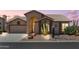 Charming single-story home featuring desert landscaping, a two-car garage, and a covered front entry at 6080 S Jojoba Ct, Gold Canyon, AZ 85118