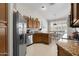 Well-lit kitchen featuring stainless steel appliances and ample counter space at 6080 S Jojoba Ct, Gold Canyon, AZ 85118