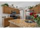 Beautiful kitchen with granite counters, stainless steel appliances, and well-crafted wood cabinetry at 6080 S Jojoba Ct, Gold Canyon, AZ 85118