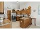 Open kitchen featuring stainless steel appliances and ample cabinet space at 6080 S Jojoba Ct, Gold Canyon, AZ 85118
