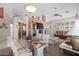 Open-concept space includes a living area with comfortable seating and dining table with chairs at 6080 S Jojoba Ct, Gold Canyon, AZ 85118