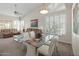 Bright living room featuring neutral tones, vaulted ceilings, and a dining area at 6080 S Jojoba Ct, Gold Canyon, AZ 85118