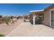 Beautiful tiled patio with pergola, showcasing a relaxing outdoor space and desert landscaping at 6080 S Jojoba Ct, Gold Canyon, AZ 85118
