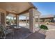 Covered patio featuring brick flooring, seating, and a ceiling fan, perfect for outdoor relaxation and entertaining at 6080 S Jojoba Ct, Gold Canyon, AZ 85118