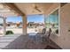 Inviting covered patio area perfect for outdoor dining and enjoying the desert landscape at 6080 S Jojoba Ct, Gold Canyon, AZ 85118