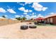 Spacious backyard with a patio, furniture, and clear skies at 6302 E Portia St, Mesa, AZ 85215