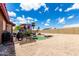 Backyard featuring a fire pit, ample open space, and seating at 6302 E Portia St, Mesa, AZ 85215