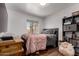 Cozy bedroom features a window, wooden desk and stuffed animal detail at 6302 E Portia St, Mesa, AZ 85215