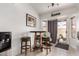 Cozy dining area featuring a small round table with three stools, perfect for casual meals at 6302 E Portia St, Mesa, AZ 85215