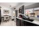 Bright kitchen features white countertops, black cabinets, and backyard views at 6302 E Portia St, Mesa, AZ 85215
