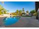 Beautiful pool with a large patio, outdoor grill, lounge seating, and mature landscaping at 7821 N Via De La Sombre --, Scottsdale, AZ 85258