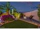Landscaped backyard offers an inviting outdoor space with synthetic grass and an outdoor lounge area at 7821 N Via De La Sombre --, Scottsdale, AZ 85258