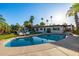 Stunning backyard featuring a pool, outdoor kitchen, lush landscaping, and lounge seating at 7821 N Via De La Sombre --, Scottsdale, AZ 85258