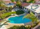 Aerial view of a backyard featuring a pool, outdoor kitchen, patio, and well-manicured landscaping at 7821 N Via De La Sombre --, Scottsdale, AZ 85258