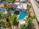 Aerial view of the backyard highlighting a pool, outdoor kitchen, patio, and lush landscaping at 7821 N Via De La Sombre --, Scottsdale, AZ 85258