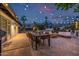 Outdoor living space with string lights, a built-in grill, and dining area at 7821 N Via De La Sombre --, Scottsdale, AZ 85258