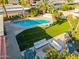 Aerial view of a backyard featuring a pool, outdoor kitchen, patio, and well-manicured landscaping at 7821 N Via De La Sombre --, Scottsdale, AZ 85258