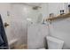 Neutral bathroom featuring shower stall, toilet, and decorative shelves with modern fixtures at 7821 N Via De La Sombre --, Scottsdale, AZ 85258