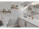 Neutral bathroom featuring quartz countertops, white cabinets, gold hardware, decorative shelves, and toilet at 7821 N Via De La Sombre --, Scottsdale, AZ 85258