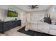 Bright bedroom with TV, wood floors, black accents, white walls, and view to en-suite bathroom at 7821 N Via De La Sombre --, Scottsdale, AZ 85258