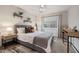 Well-lit bedroom with plush bed, light gray walls, bright window, and cozy decor at 7821 N Via De La Sombre --, Scottsdale, AZ 85258