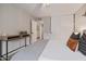 Bright bedroom featuring a work area, ample closet space, and cozy decor at 7821 N Via De La Sombre --, Scottsdale, AZ 85258