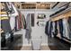 Custom walk-in closet featuring black storage, shelving, drawers, laundry basket, and clothing racks at 7821 N Via De La Sombre --, Scottsdale, AZ 85258