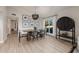 Dining room features a modern chandelier, wood look floors, and ample natural light at 7821 N Via De La Sombre --, Scottsdale, AZ 85258