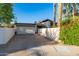 Exterior daytime view of the house, showcasing the garage and surrounding wall at 7821 N Via De La Sombre --, Scottsdale, AZ 85258
