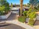 Charming single-story home featuring a tile roof, attached garage, and desert landscaping at 7821 N Via De La Sombre --, Scottsdale, AZ 85258