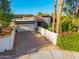 Charming single-story home featuring a tile roof, attached garage, and desert landscaping at 7821 N Via De La Sombre --, Scottsdale, AZ 85258