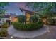 Landscaped front yard with concrete circular walkway and well manicured hedge at 7821 N Via De La Sombre --, Scottsdale, AZ 85258