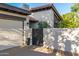Home exterior with attached garage and secure entry gate to the front entrance at 7821 N Via De La Sombre --, Scottsdale, AZ 85258
