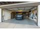 Organized garage with a black car, ample storage bins, and wall-mounted tools at 7821 N Via De La Sombre --, Scottsdale, AZ 85258