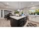 Elegant kitchen with center island and stainless steel appliances, with a view to the outdoor pool at 7821 N Via De La Sombre --, Scottsdale, AZ 85258