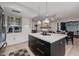 Kitchen featuring a center island and stainless steel appliances with a view to the dining area at 7821 N Via De La Sombre --, Scottsdale, AZ 85258