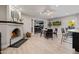 Spacious living room featuring a fireplace, dining area, and access to an office space at 7821 N Via De La Sombre --, Scottsdale, AZ 85258
