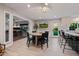 Bright living area with a dining table, office access, and view to backyard at 7821 N Via De La Sombre --, Scottsdale, AZ 85258