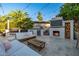 Outdoor kitchen with built-in BBQ, mini-fridge, fireplace and comfortable seating at 7821 N Via De La Sombre --, Scottsdale, AZ 85258