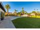 Sparkling pool with tanning shelf, lush tropical landscaping, and ample patio space at 7821 N Via De La Sombre --, Scottsdale, AZ 85258