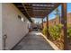 Side yard featuring concrete patio cover with lush landscaping, and BBQ at 7821 N Via De La Sombre --, Scottsdale, AZ 85258