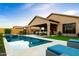 Backyard with pool, spa, covered patio, and lounge chairs, ideal for outdoor entertaining and relaxation at 8633 E Kael Cir, Mesa, AZ 85207
